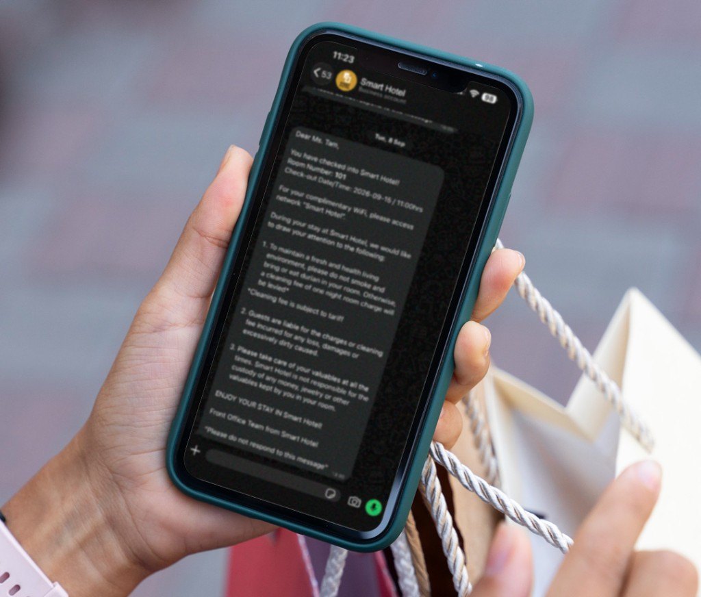 Guest receiving hotel messages on a phone